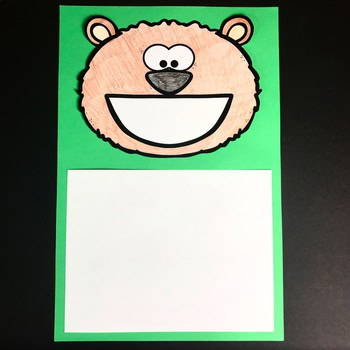 A colorful Animal Toothy® Mat featuring a smiling bear face with a large open mouth, designed for early childhood learning and sensory play, perfect for engaging young children in educational activit.