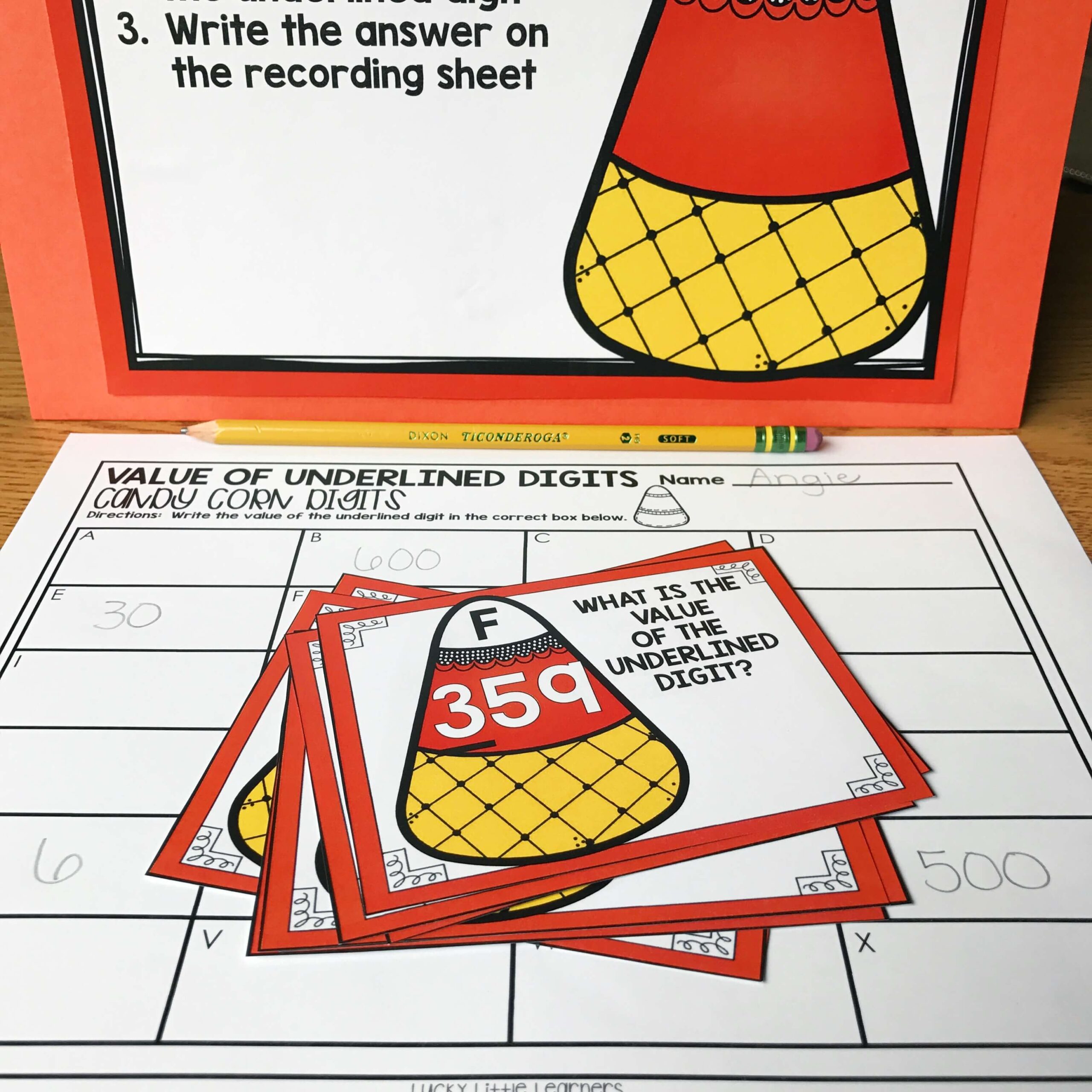 October Math Centers for 2nd Grade featuring candy corn digit value matching and recording activities, perfect for engaging second graders in fun, educational math practice.