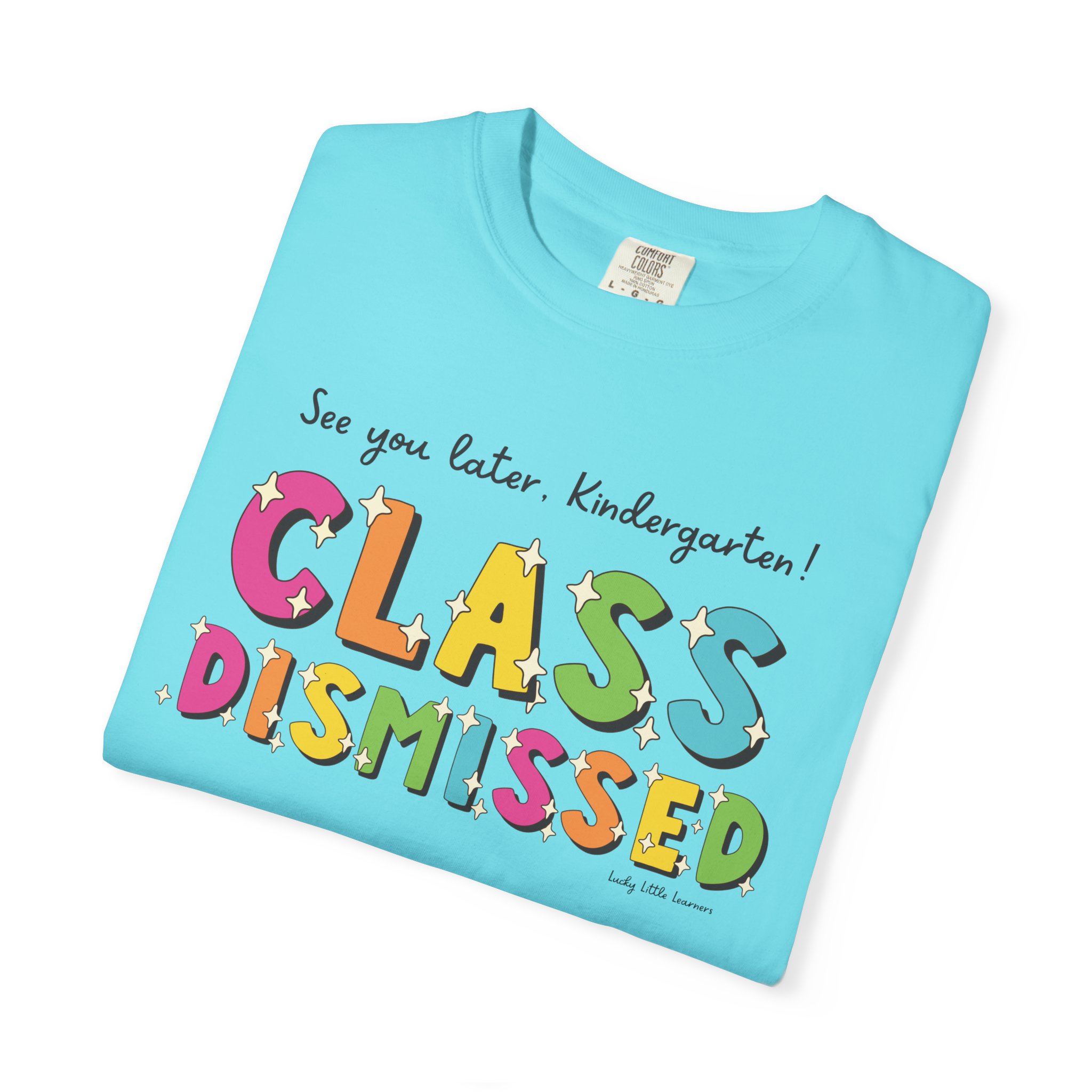 Bright blue kindergarten T-shirt with colorful "Class Dismissed" text and stars, perfect for preschool graduation or end-of-year celebrations, featuring playful, kid-friendly design.