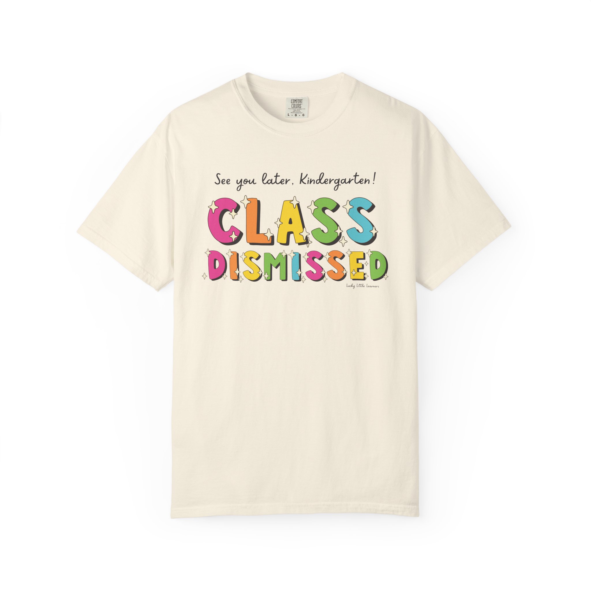 Bright white kindergarten T-shirt with colorful "Class Dismissed" text and playful font, perfect for celebrating the end of the school day for young students.