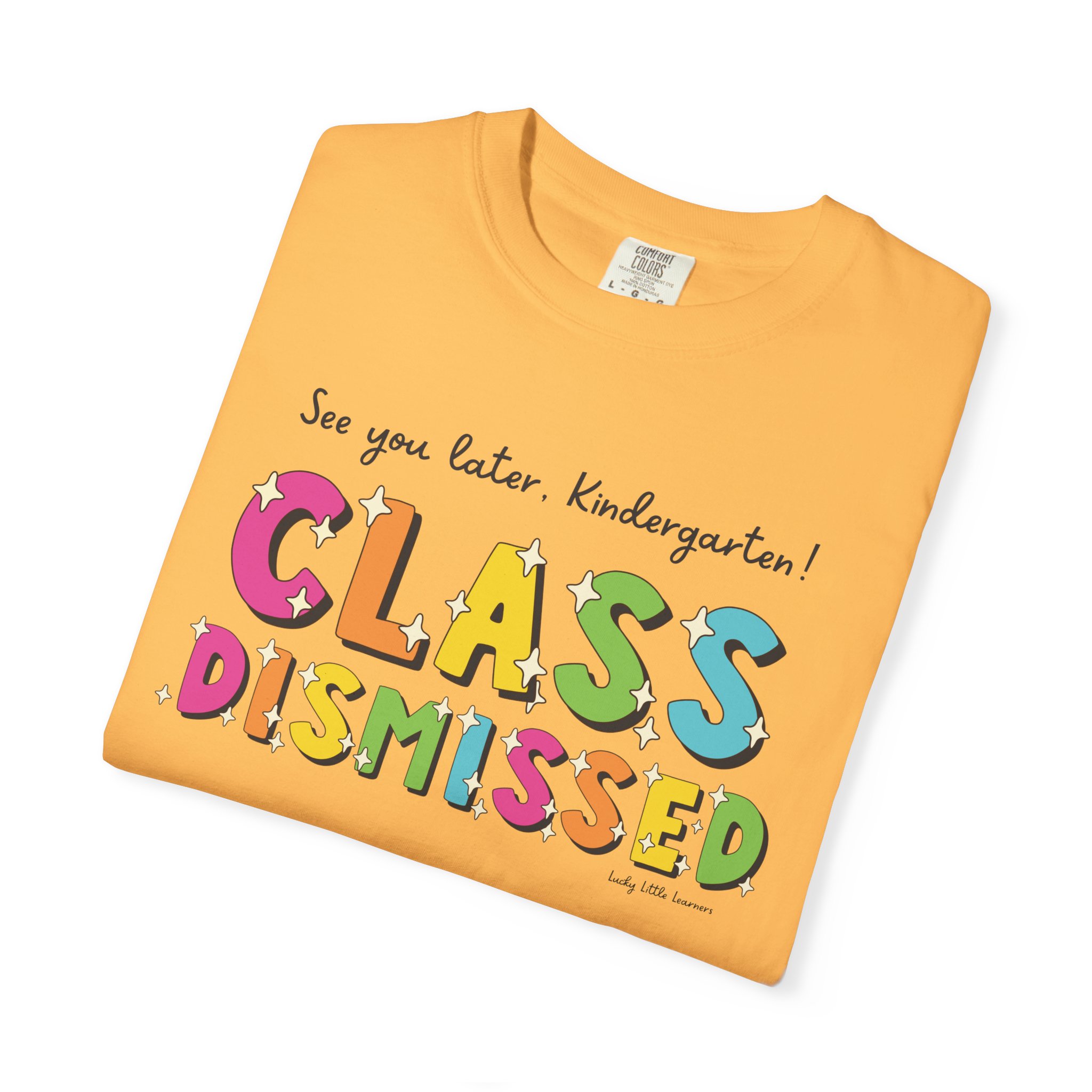 A colorful kindergarten T-shirt with the phrase "Class Dismissed" and playful lettering, perfect for celebrating the end of the school year and promoting fun, educational apparel for young learners.