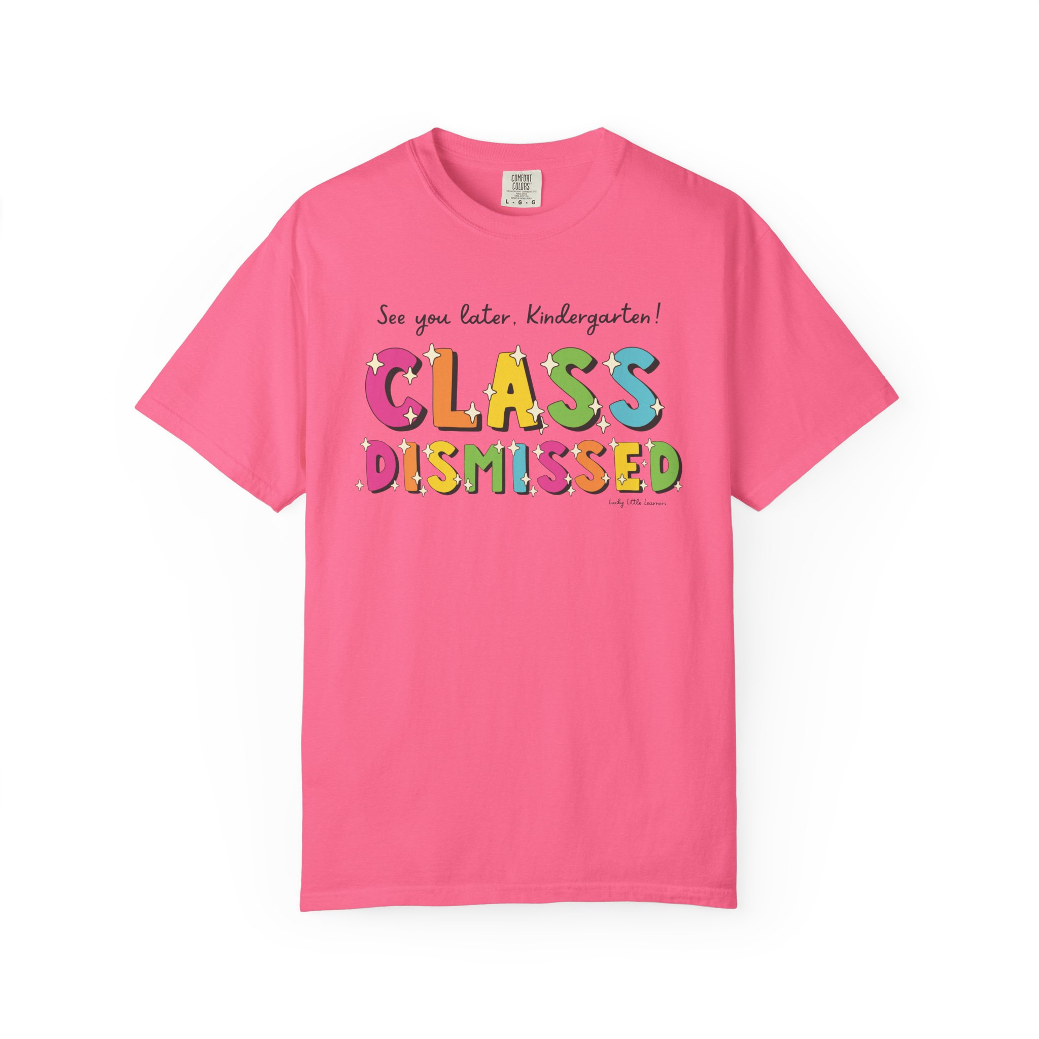 Bright pink kindergarten T-shirt with colorful "Class Dismissed" text and playful design, perfect for celebrating the end of the school day for young students.