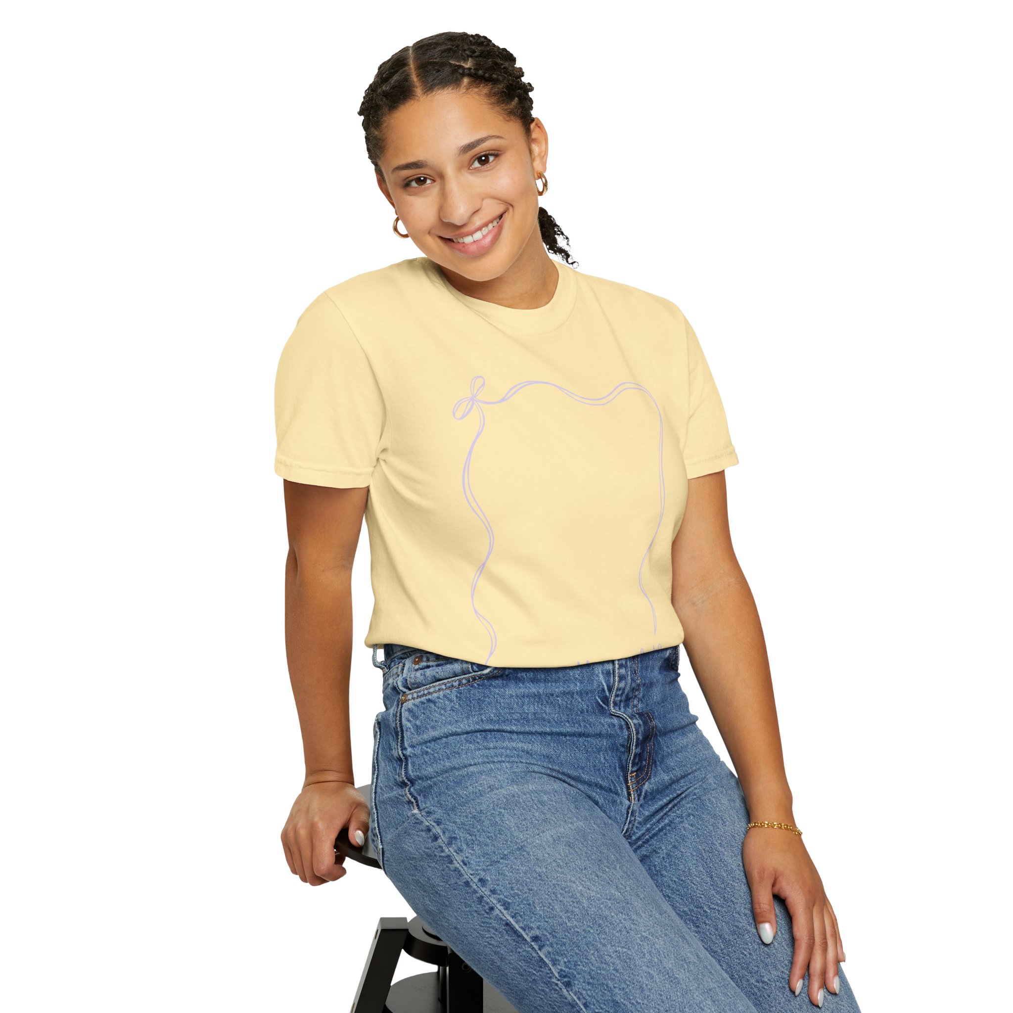 A cheerful young girl wearing a 2nd grade autograph T-shirt with a simple line drawing, sitting on a stool, celebrating teacher appreciation and year-end memories, perfect for classroom keepsakes.