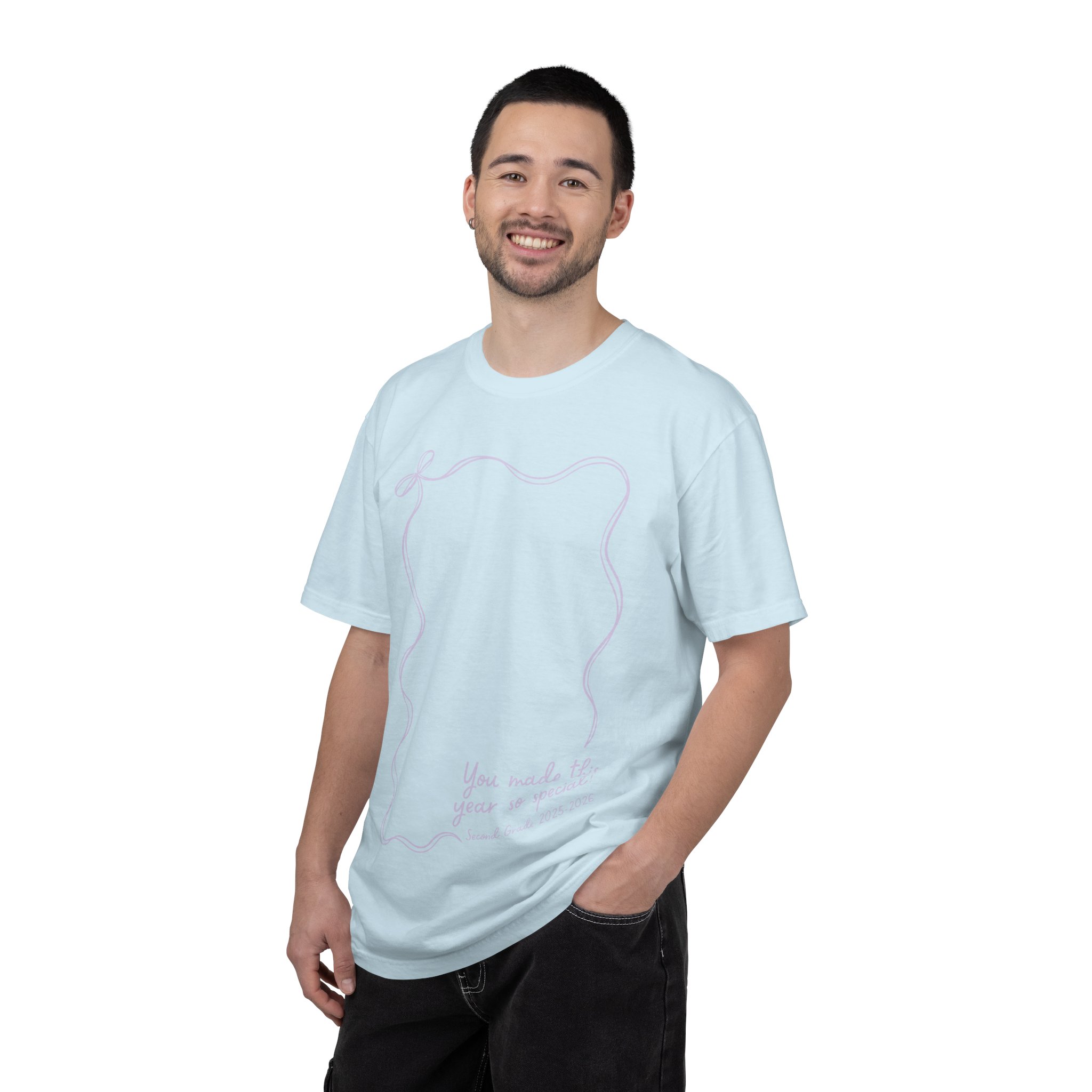 A cheerful man wearing a light blue 2nd Grade Autograph T-Shirt with teacher-themed design, perfect for year-end keepsakes and celebrating student autographs in a classroom setting.