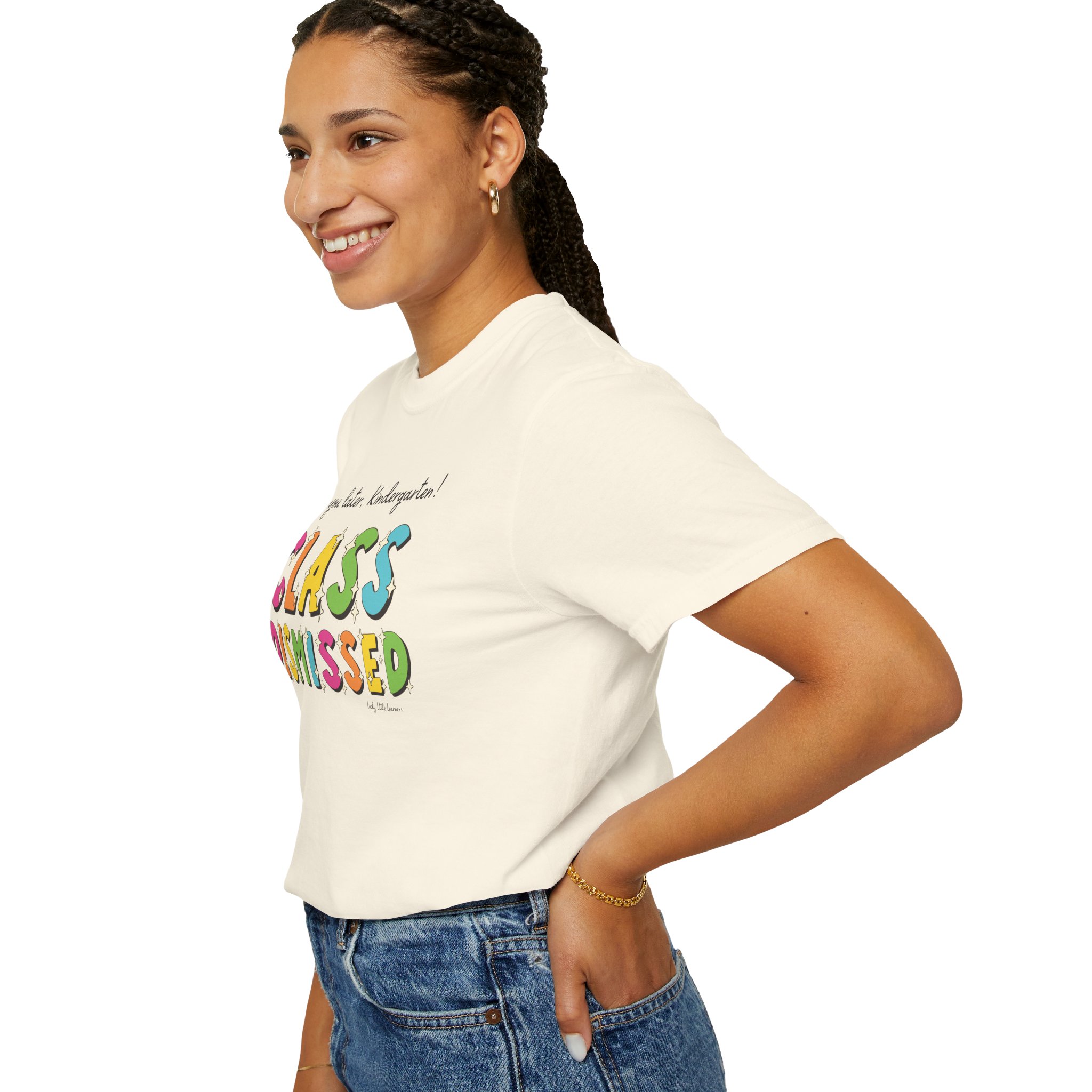 Enjoying her first day of school in a fun "Class Dismissed" kindergarten T-shirt, perfect for young learners and teachers celebrating the start of the school year.
